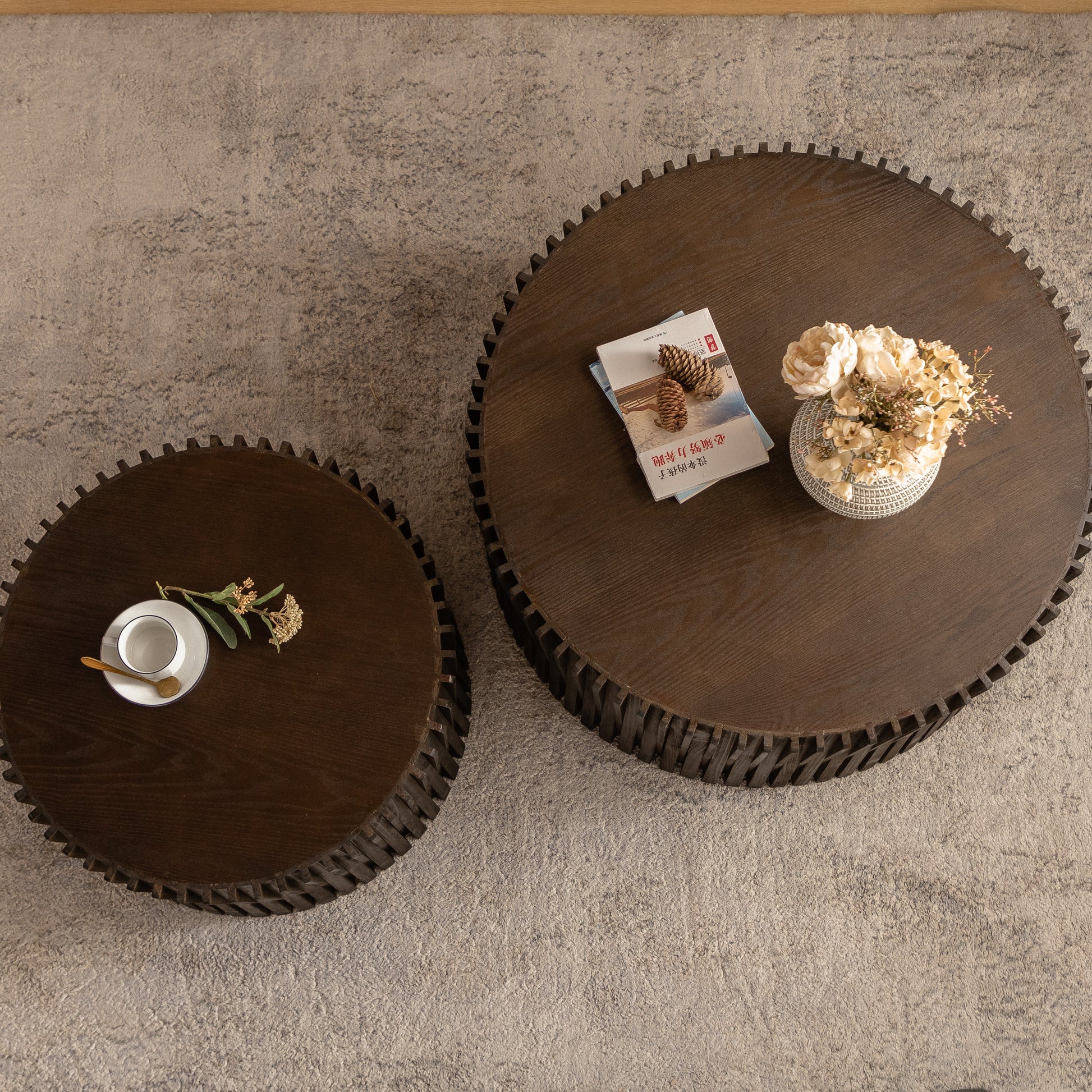 Round dark wood coffee table with ribbed base and textured rug perfect for living rooms