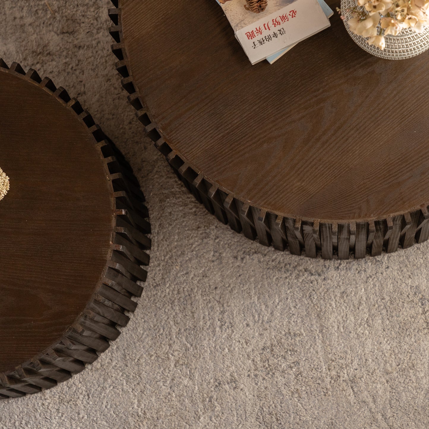 Dark wood round coffee table with intricate carved base detail