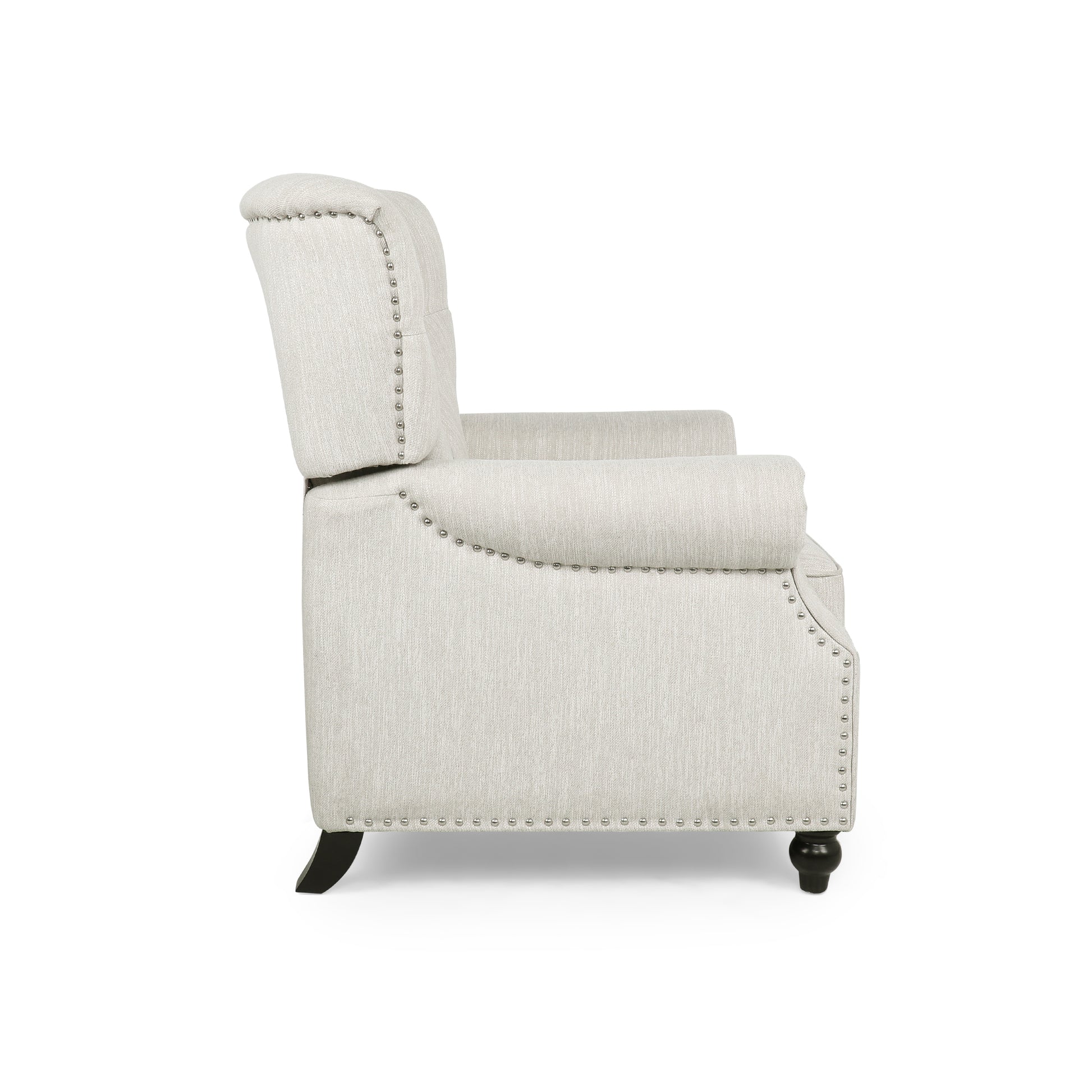 Cream fabric armchair with studded detailing on armrests and back