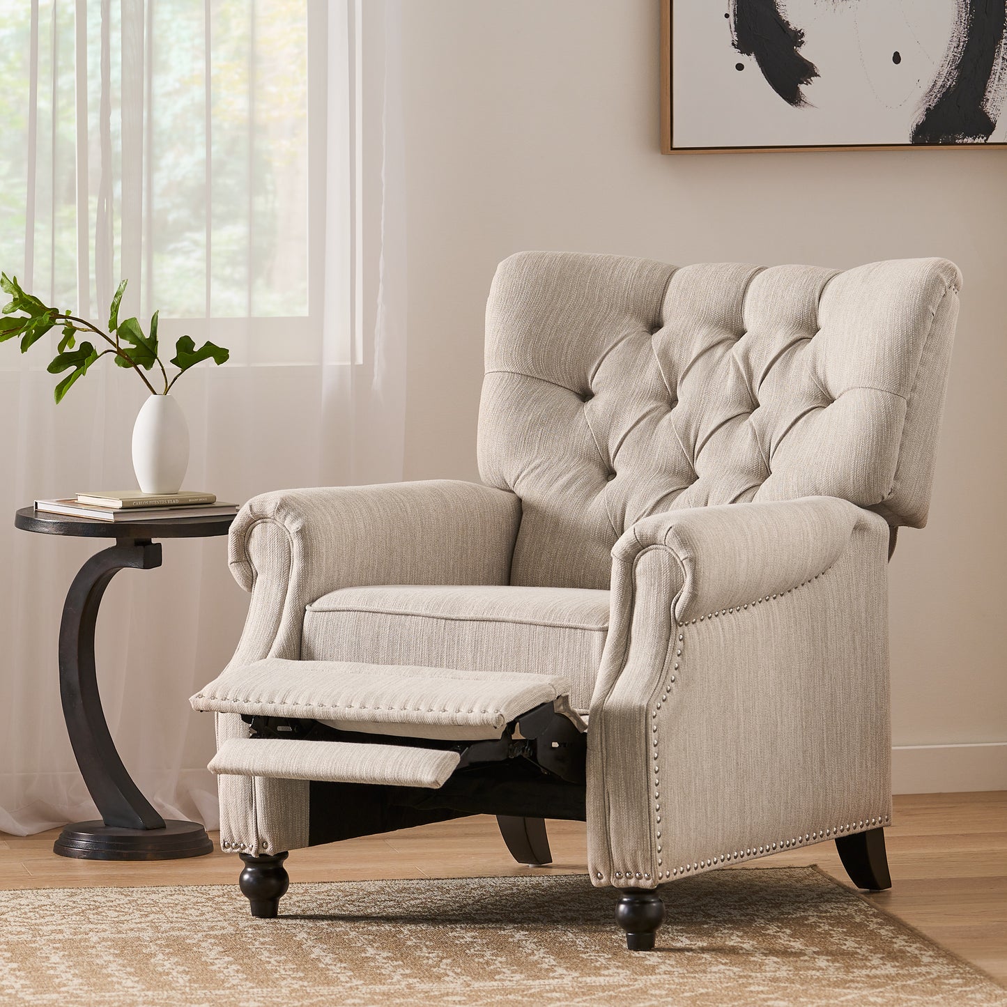 Tufted back upholstered recliner chair in beige fabric with nailhead trim accent and extended footrest