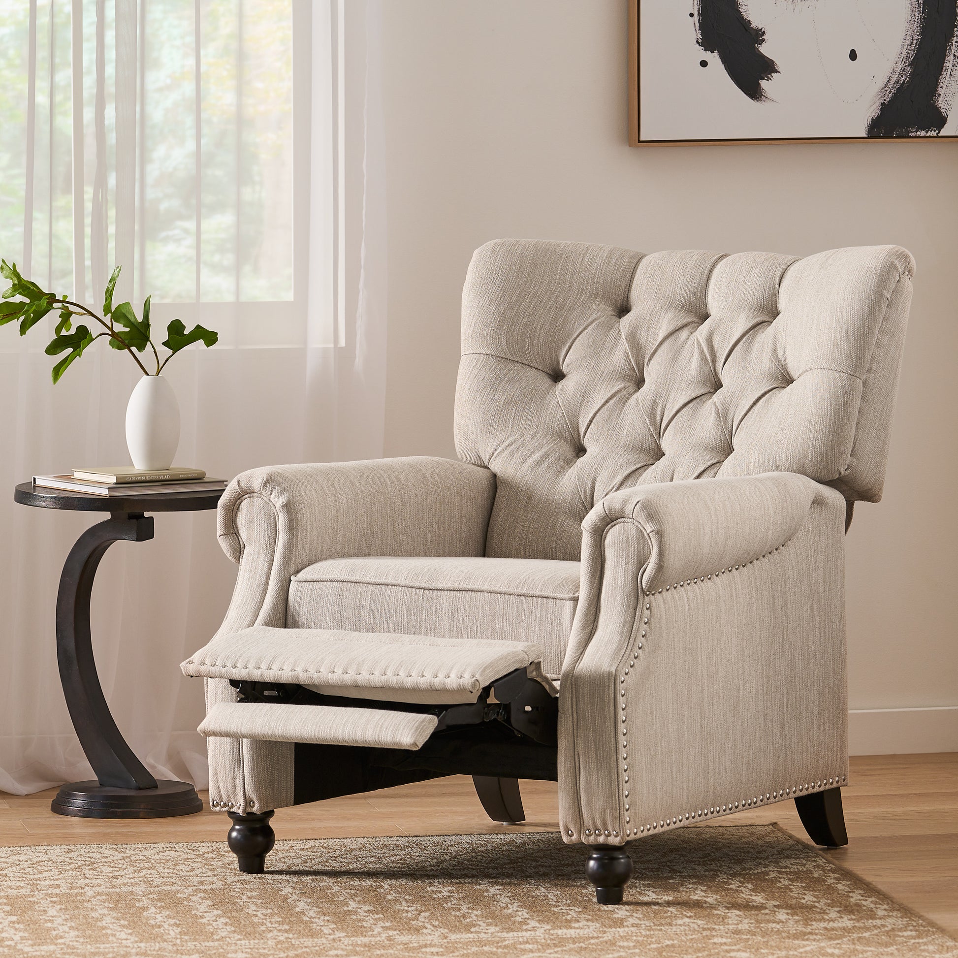 Tufted back upholstered recliner chair in beige fabric with nailhead trim accent and extended footrest