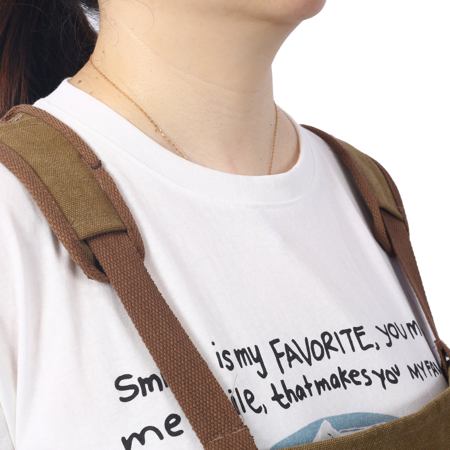 Brown canvas strap detail on a white tshirt with graphic text