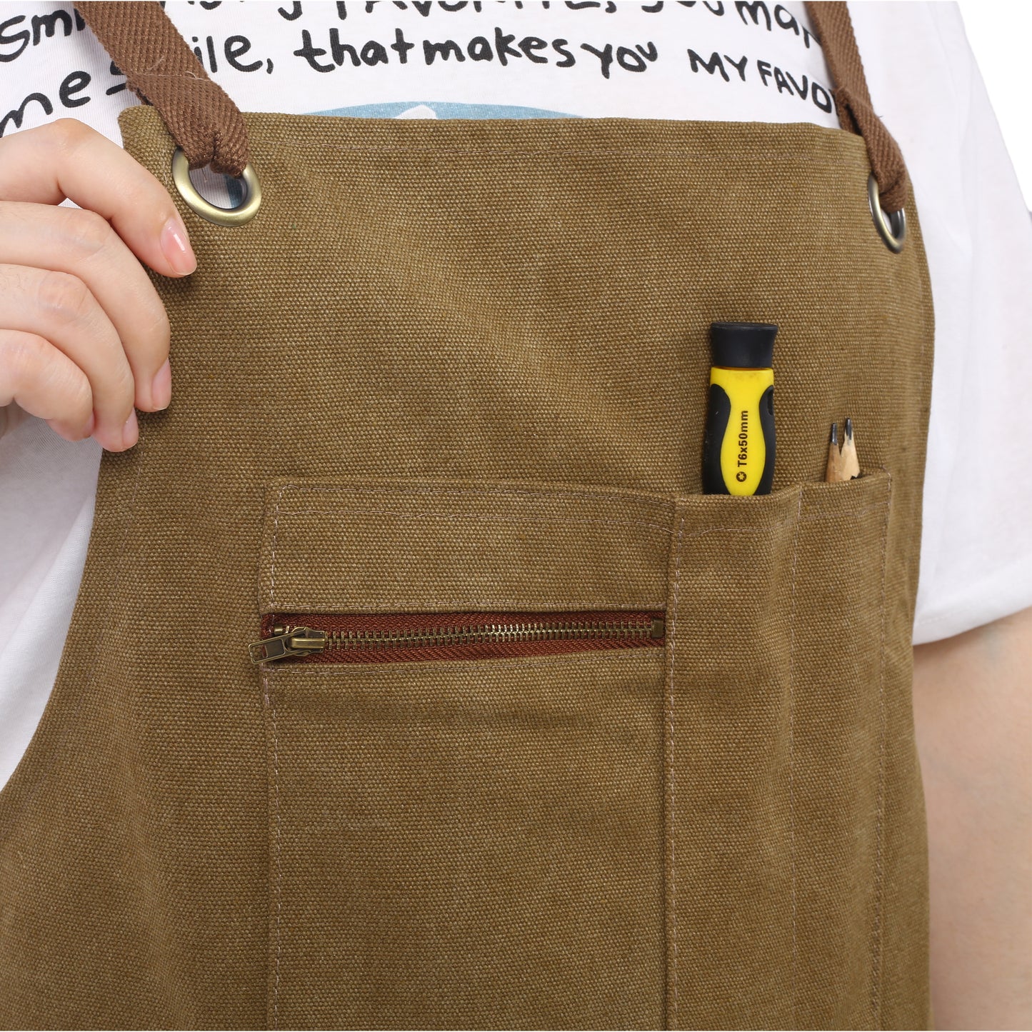 Brown canvas apron with adjustable straps and a zip pocket