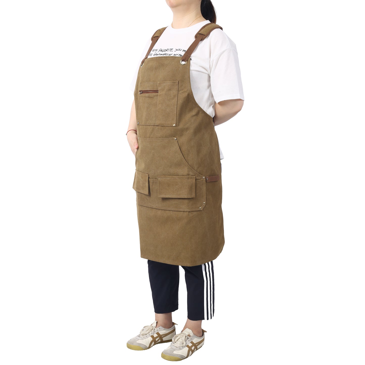 Brown canvas apron with leather straps and multiple pockets ideal for workwear