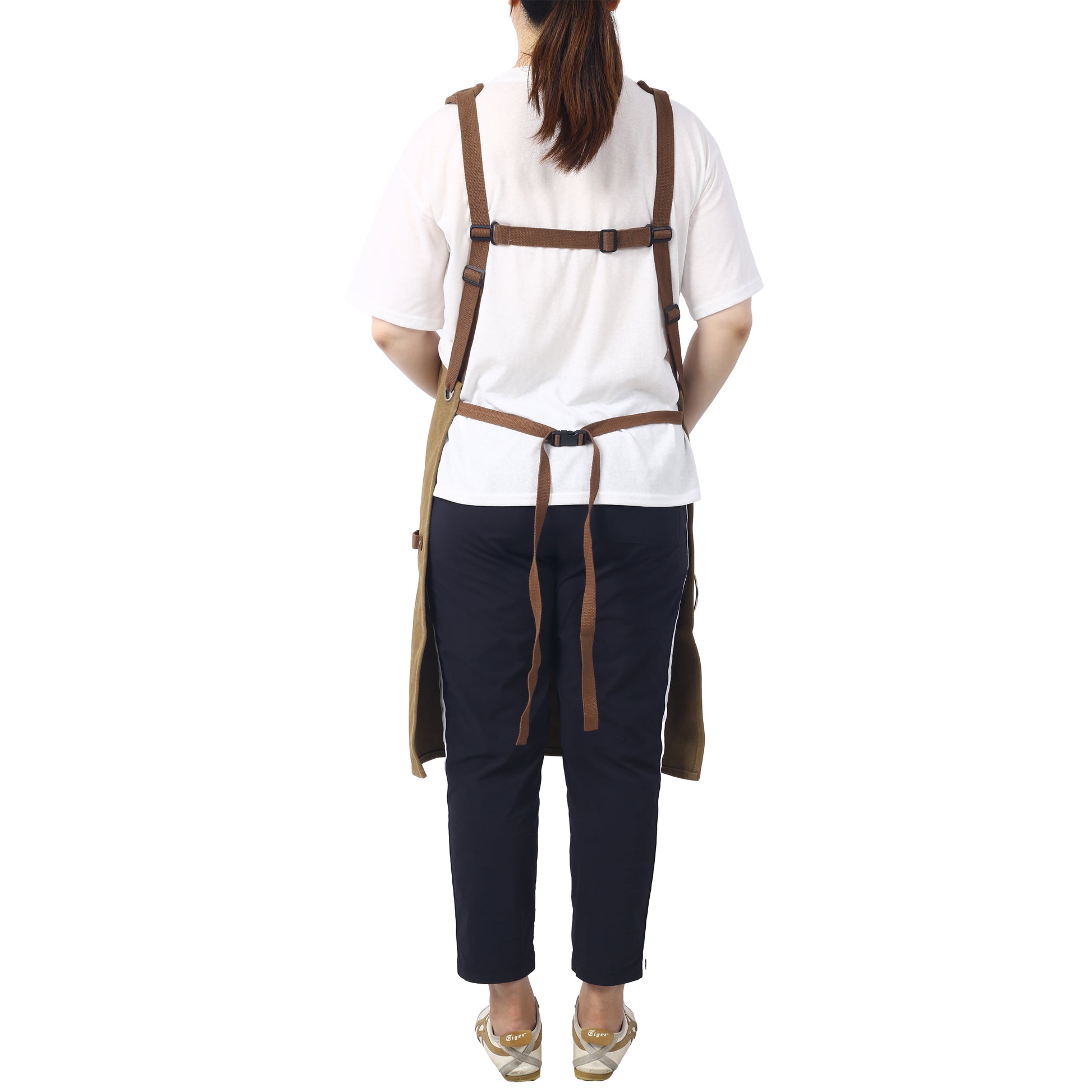 Khaki canvas apron with brown straps and adjustable buckles ideal for chefs and artists