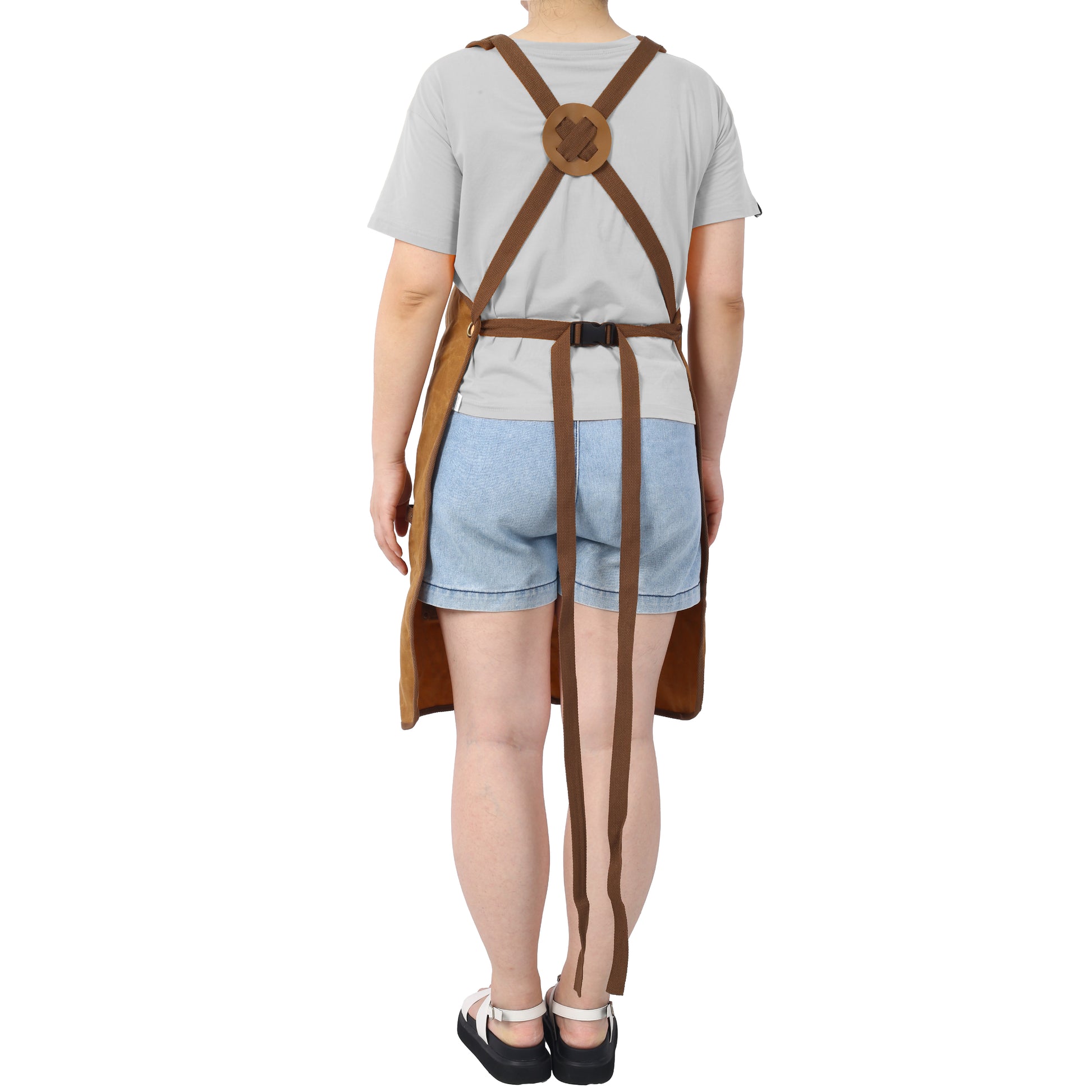 Brown canvas work apron with adjustable buckle and crossstrap back for comfort