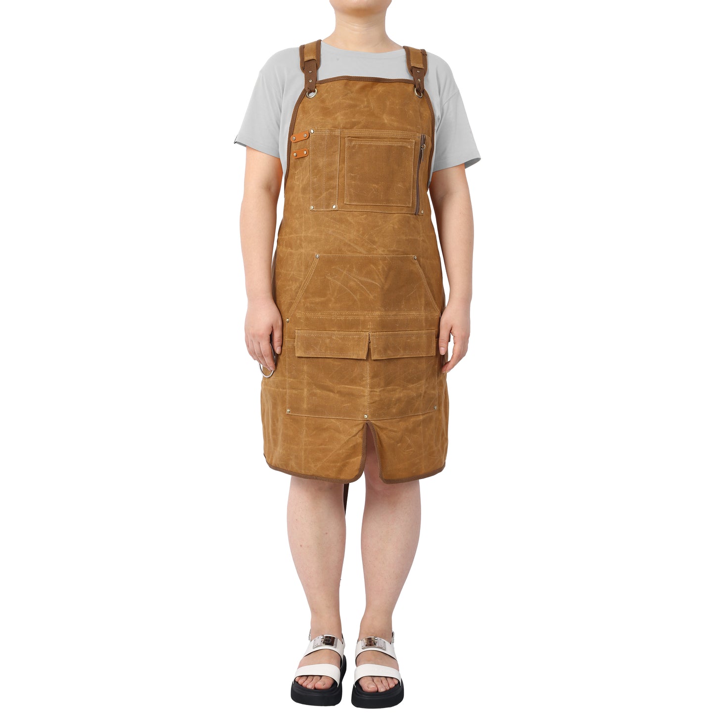 Brown canvas bib apron with multiple pockets for workwear