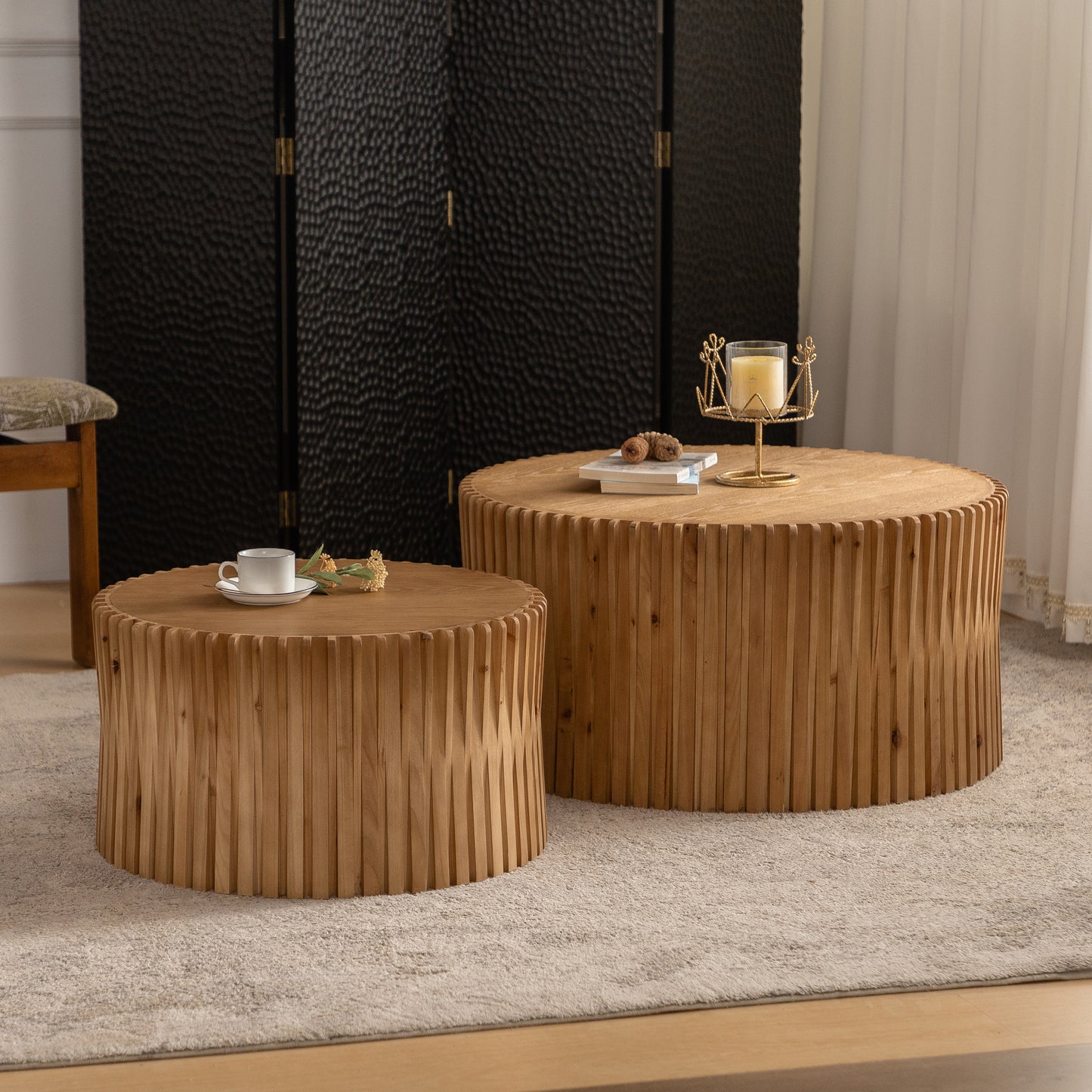 Round wood coffee table with vertical slat design and modern aesthetic