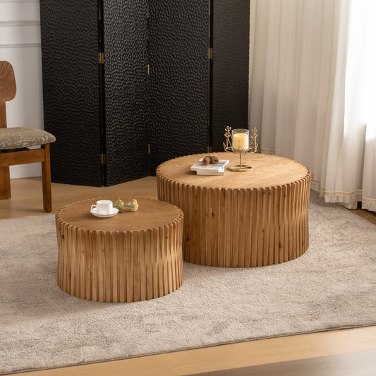 Round wooden coffee table with fluted detail and books