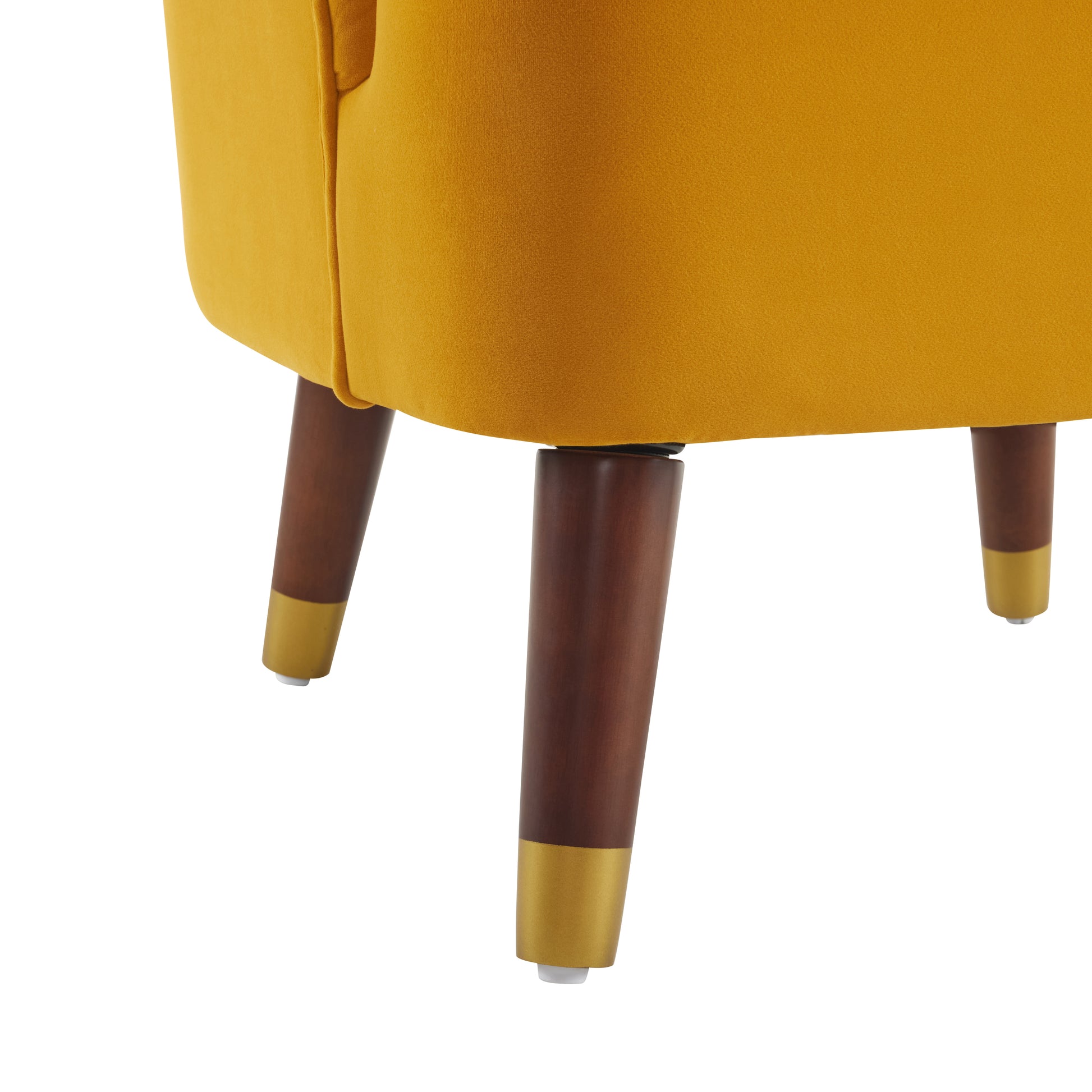 Mustard velvet accent chair with tapered wooden legs and gold accents