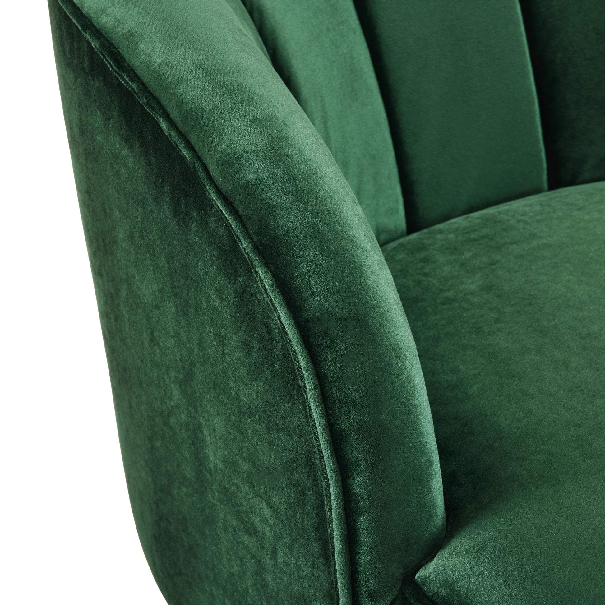 Closeup of plush emerald green velvet upholstery with channel tufting on a chair