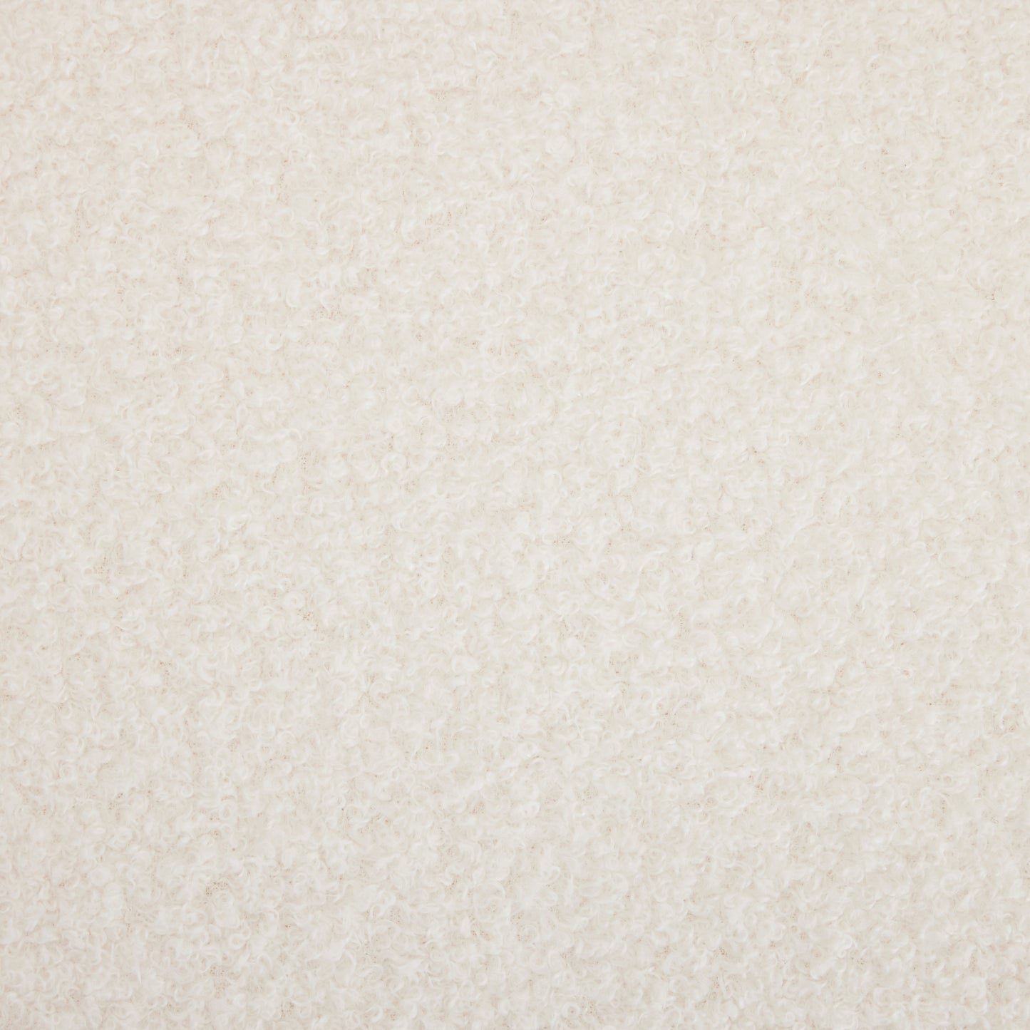 Closeup of ivory boucle fabric with its characteristic looped yarn texture