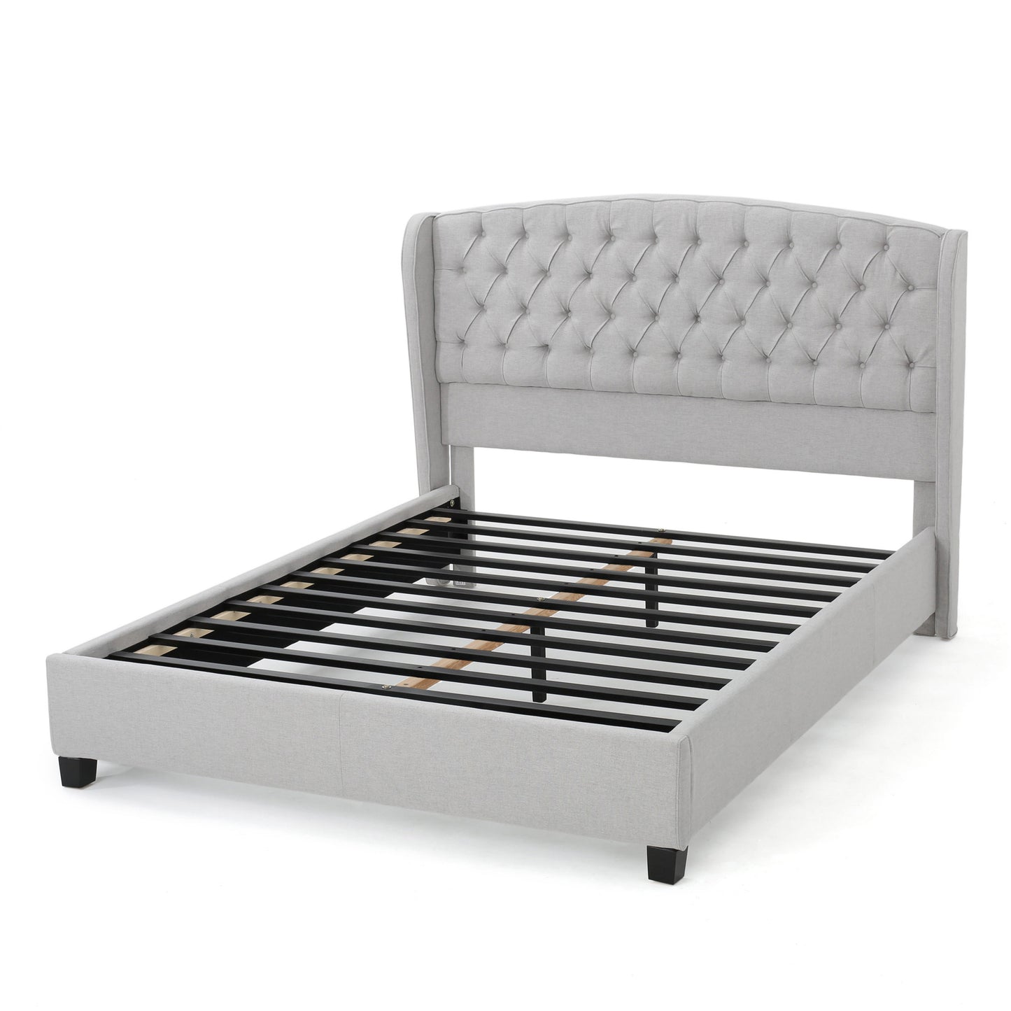 Light gray upholstered bed frame with tufted wingback headboard and metal slats