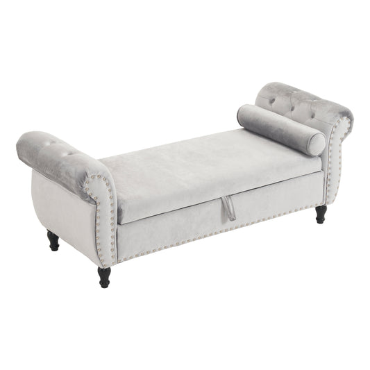 Light gray velvet storage bench with tufted details and silver nailhead trim