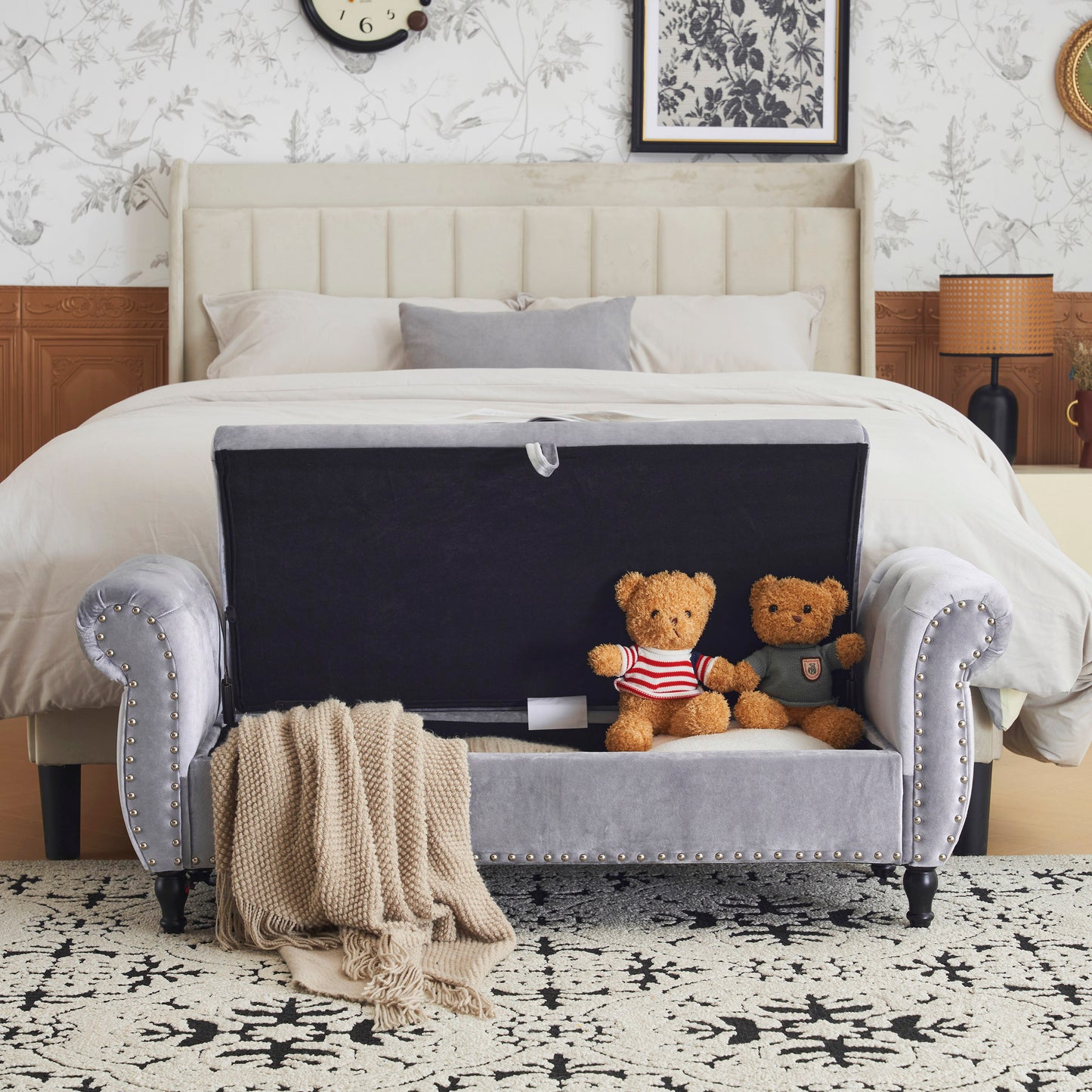 Light grey velvet storage bench with tufted details and brass studs