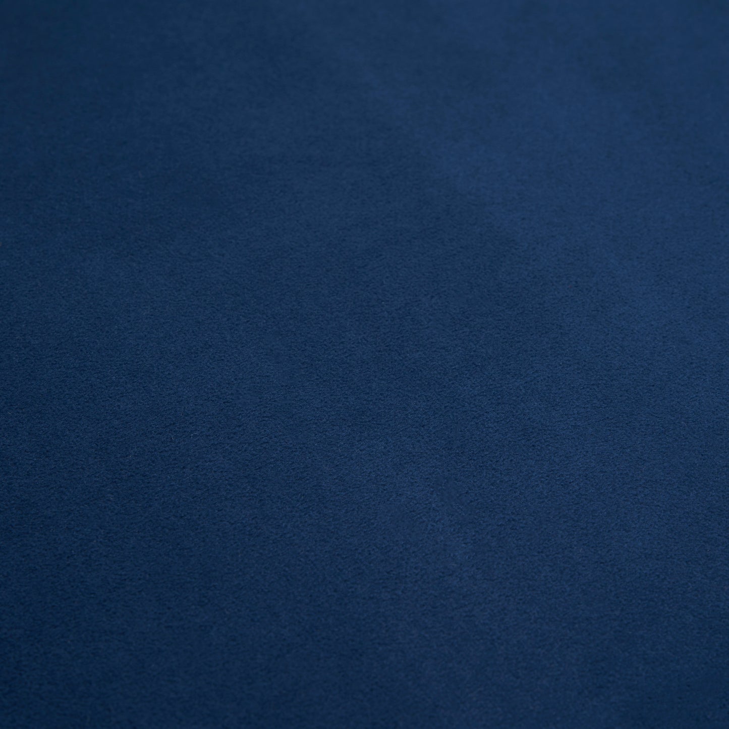 Textured navy blue fabric swatch with a subtle flecked surface