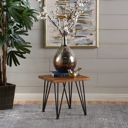 Rustic wooden side table with black hairpin legs and metallic vase