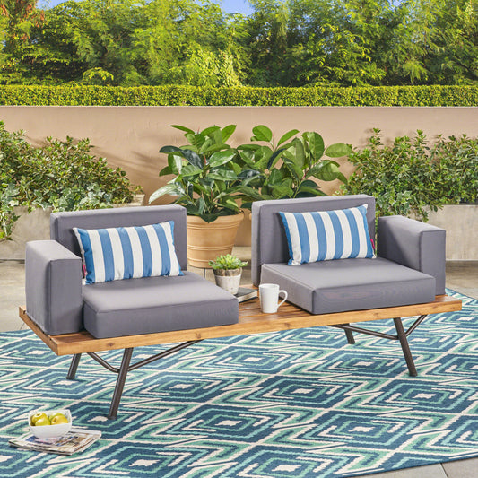 Modern grey outdoor loveseat with blue and white striped cushions on wooden slatted bench