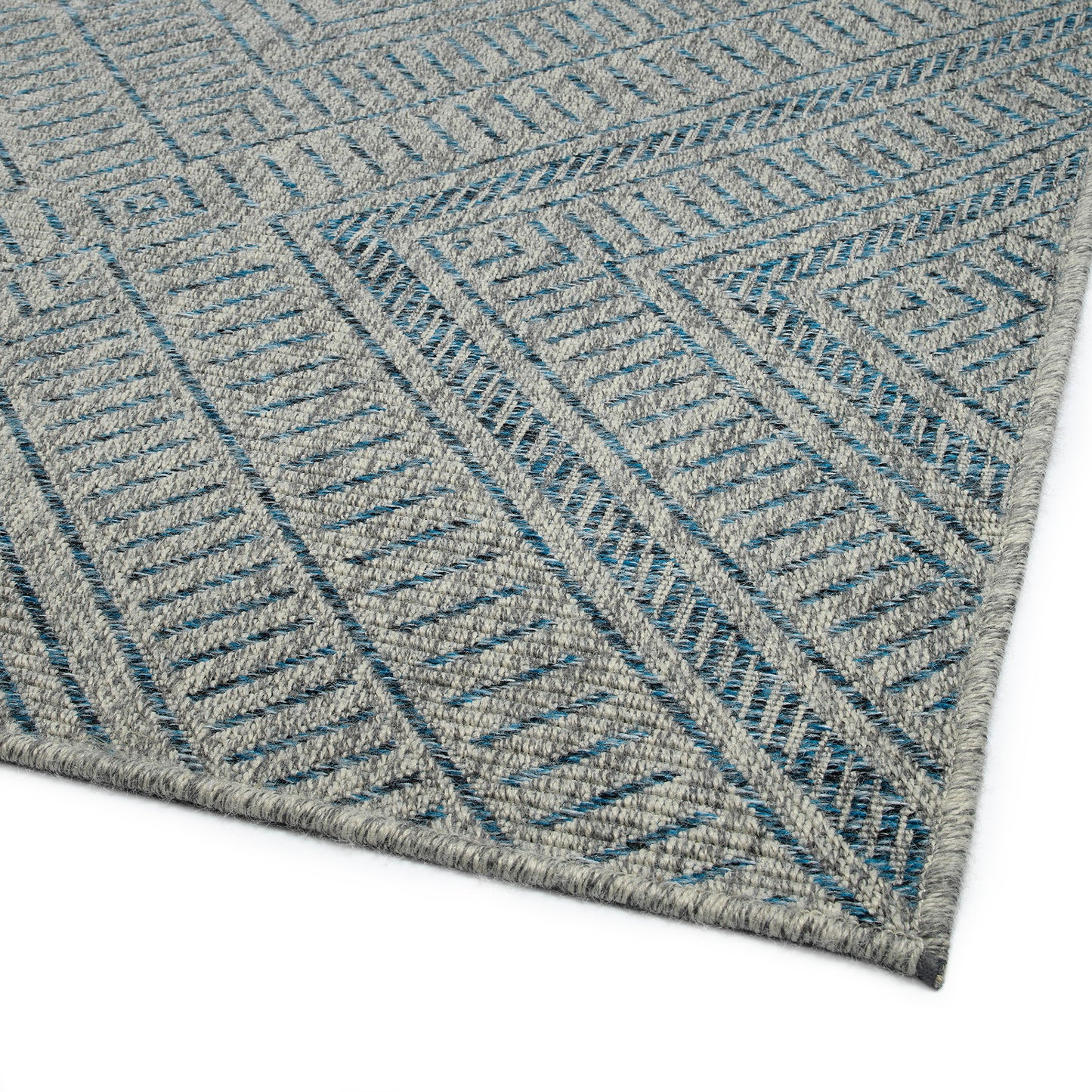 Grey area rug with blue geometric chevron pattern woven texture