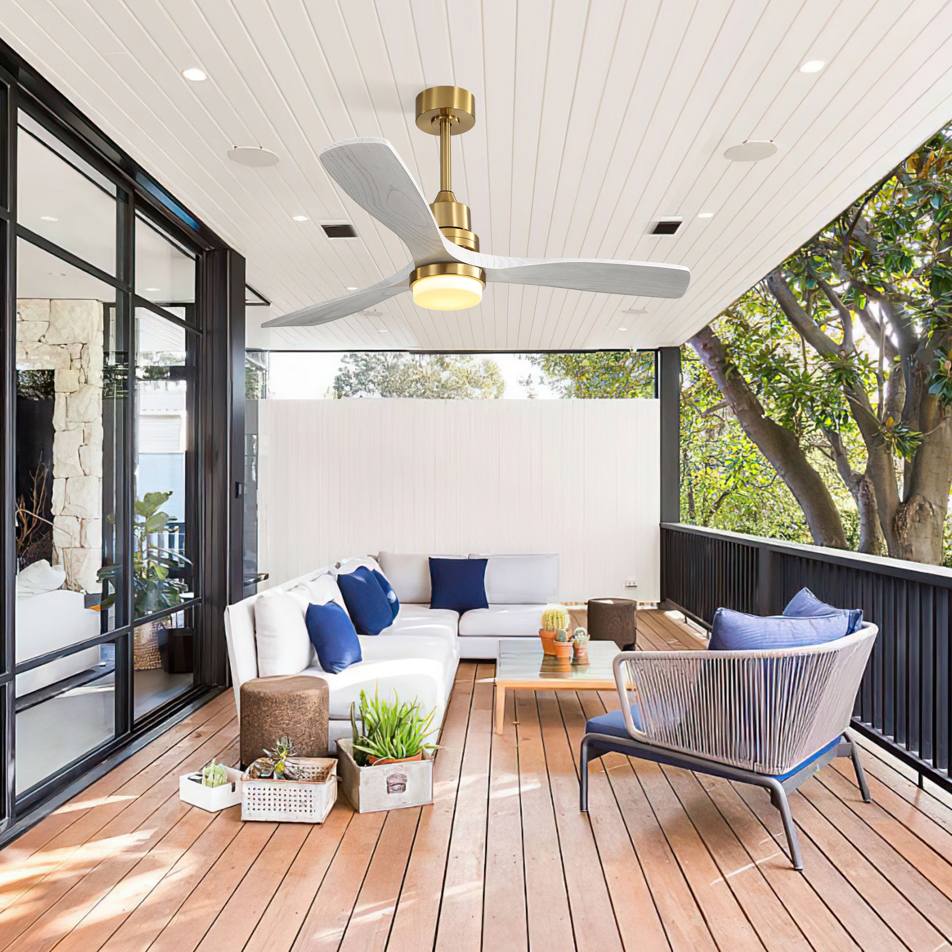 Modern outdoor ceiling fan with gold accents and white woodgrain blades with integrated LED light