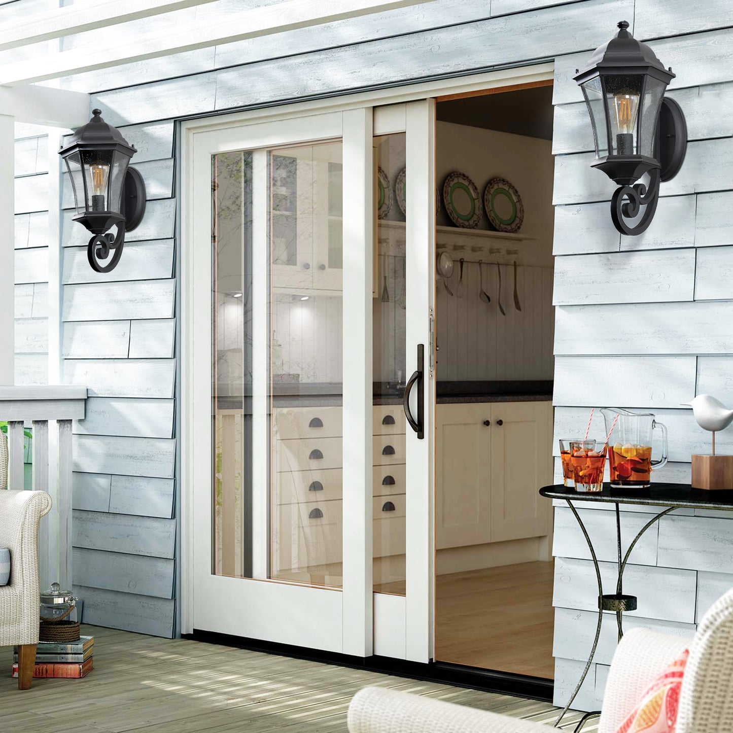 Classic black outdoor lantern with seeded glass providing warm porch lighting
