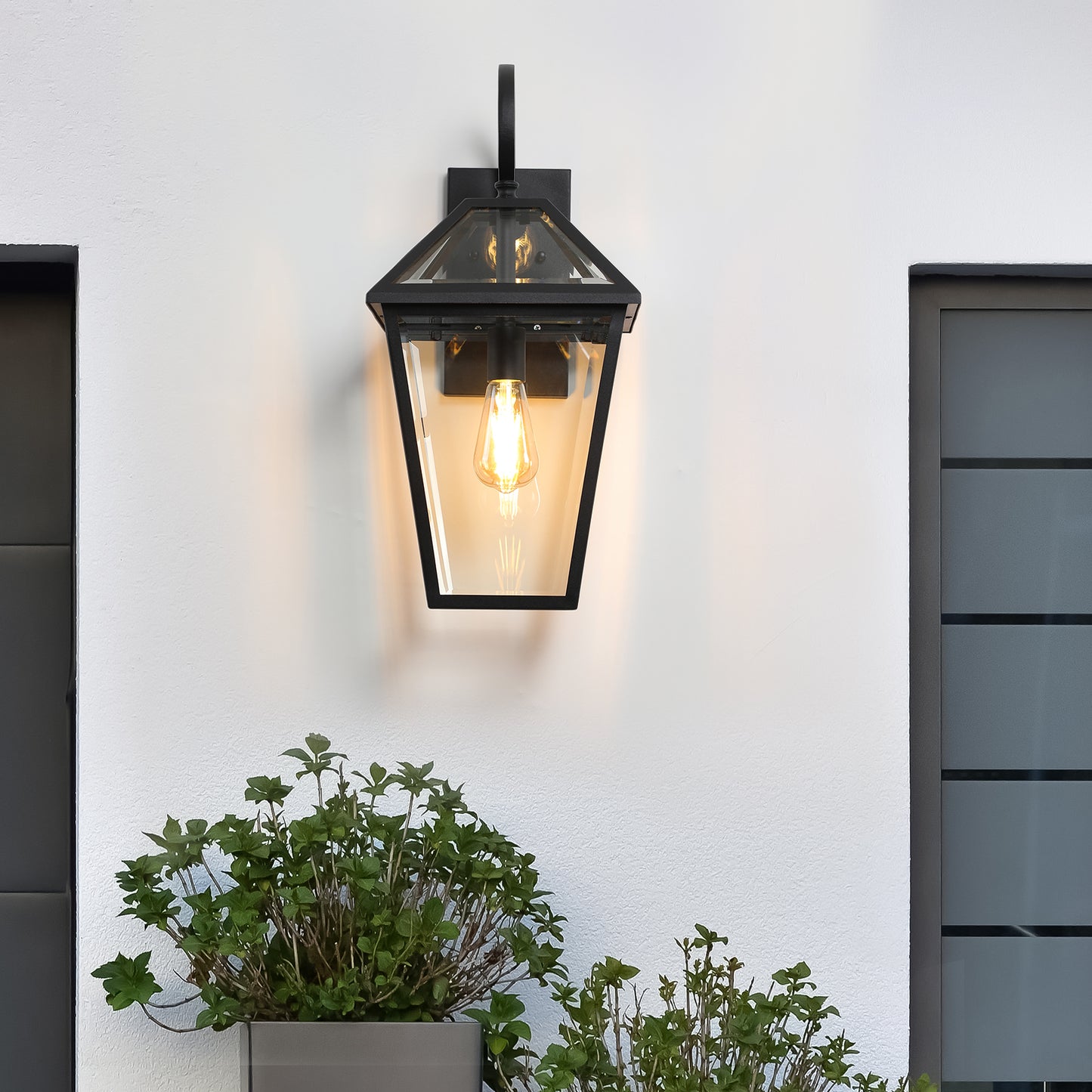 Classic black metal outdoor wall lantern with clear glass panes and Edison bulb