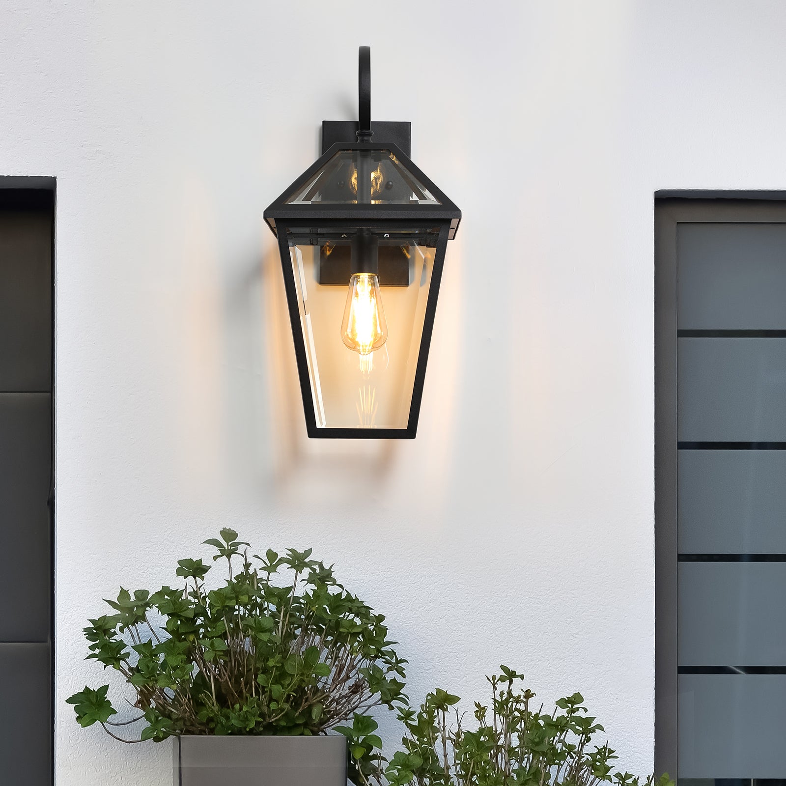 Classic black metal outdoor wall lantern with clear glass panes and Edison bulb