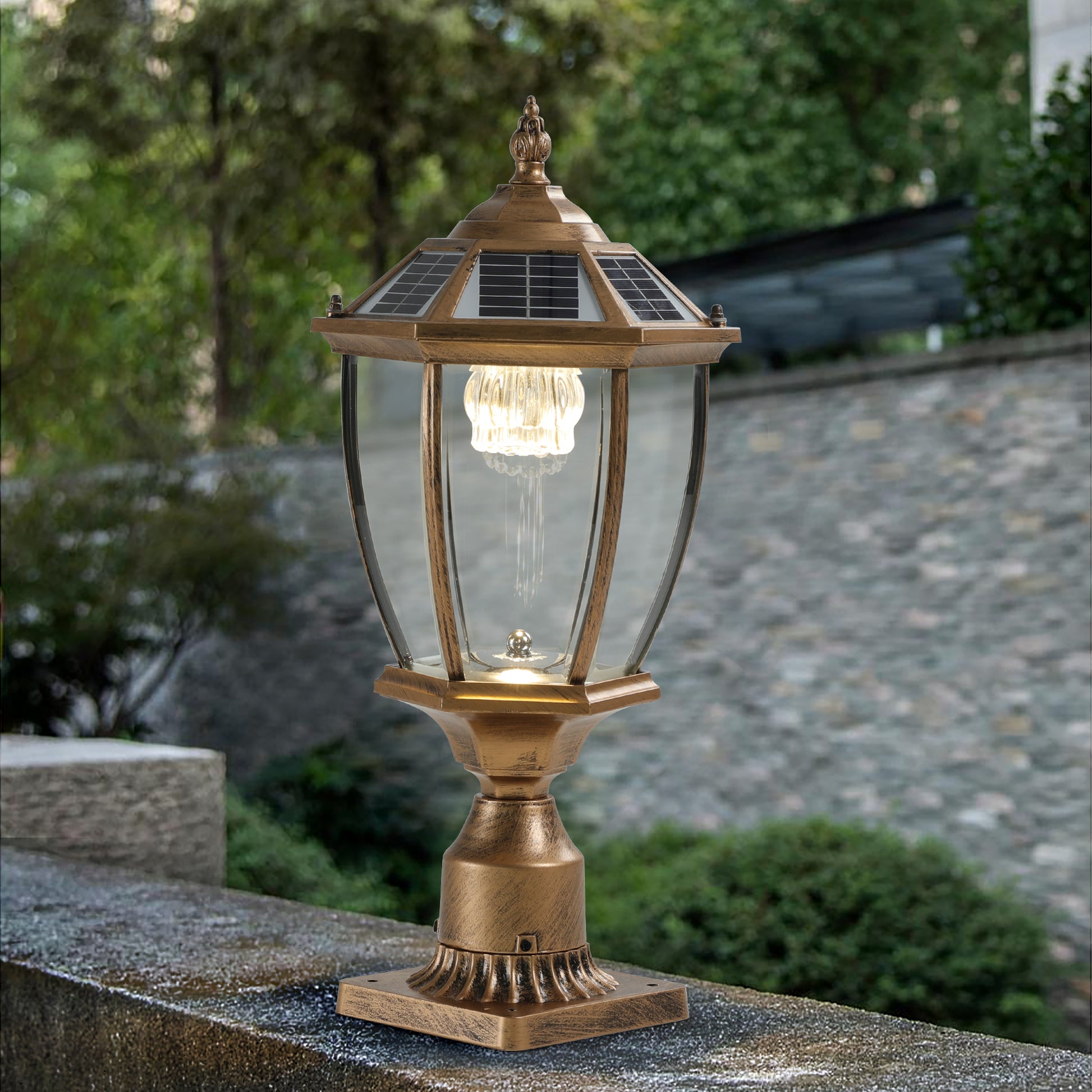 Antique brass solar post light with clear glass lantern and decorative finial