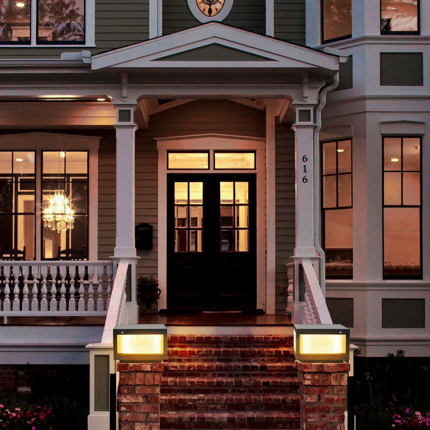 Modern black carriage lantern illuminating brick steps for exterior lighting