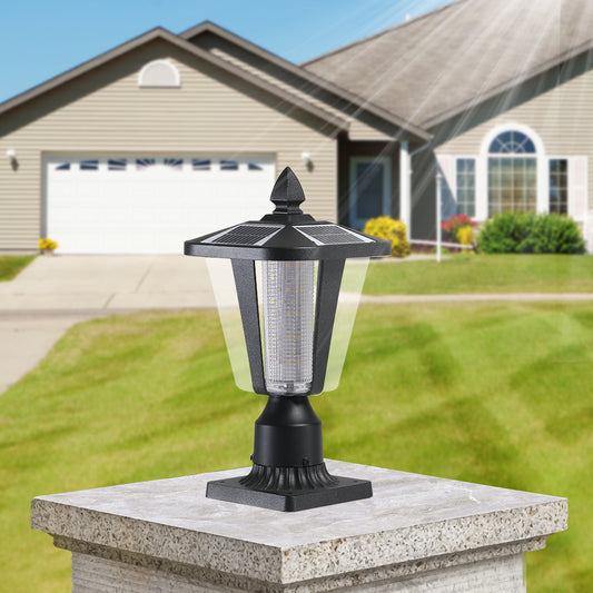 Black solar post cap light with LED bulbs illuminating outdoor spaces