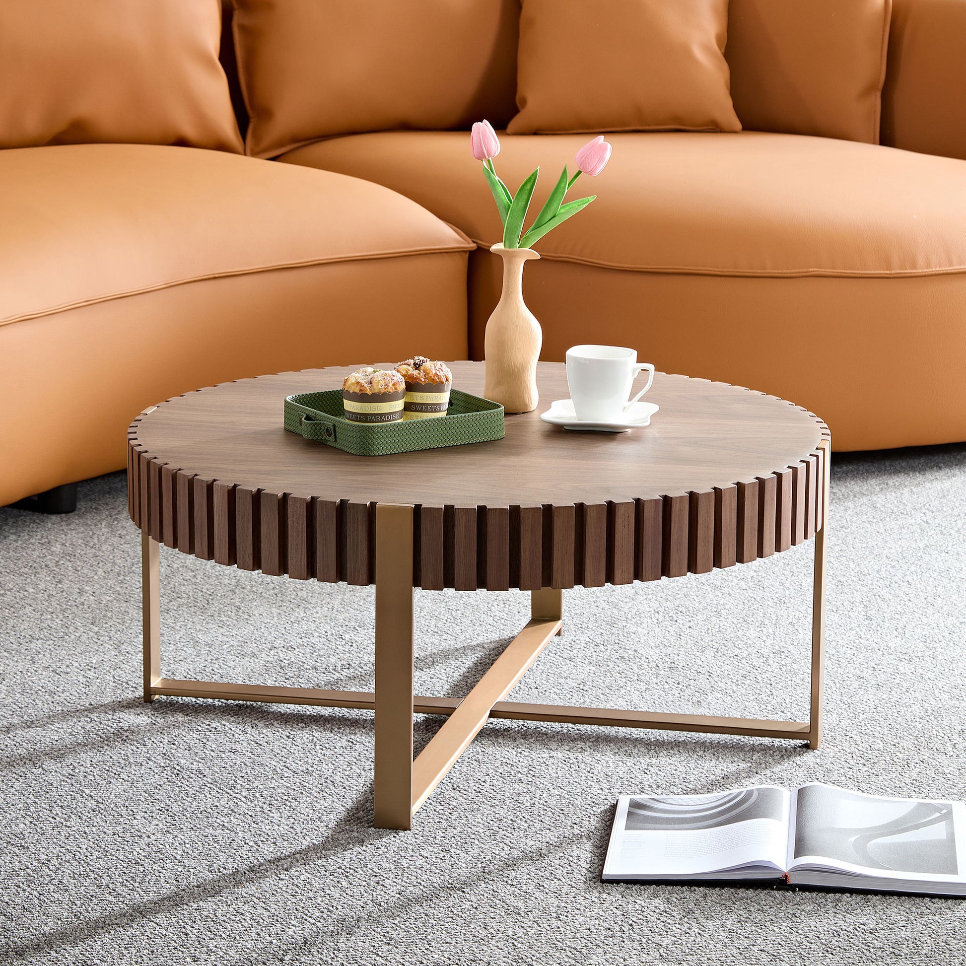 Round walnut coffee table with fluted wood detail and gold metal legs