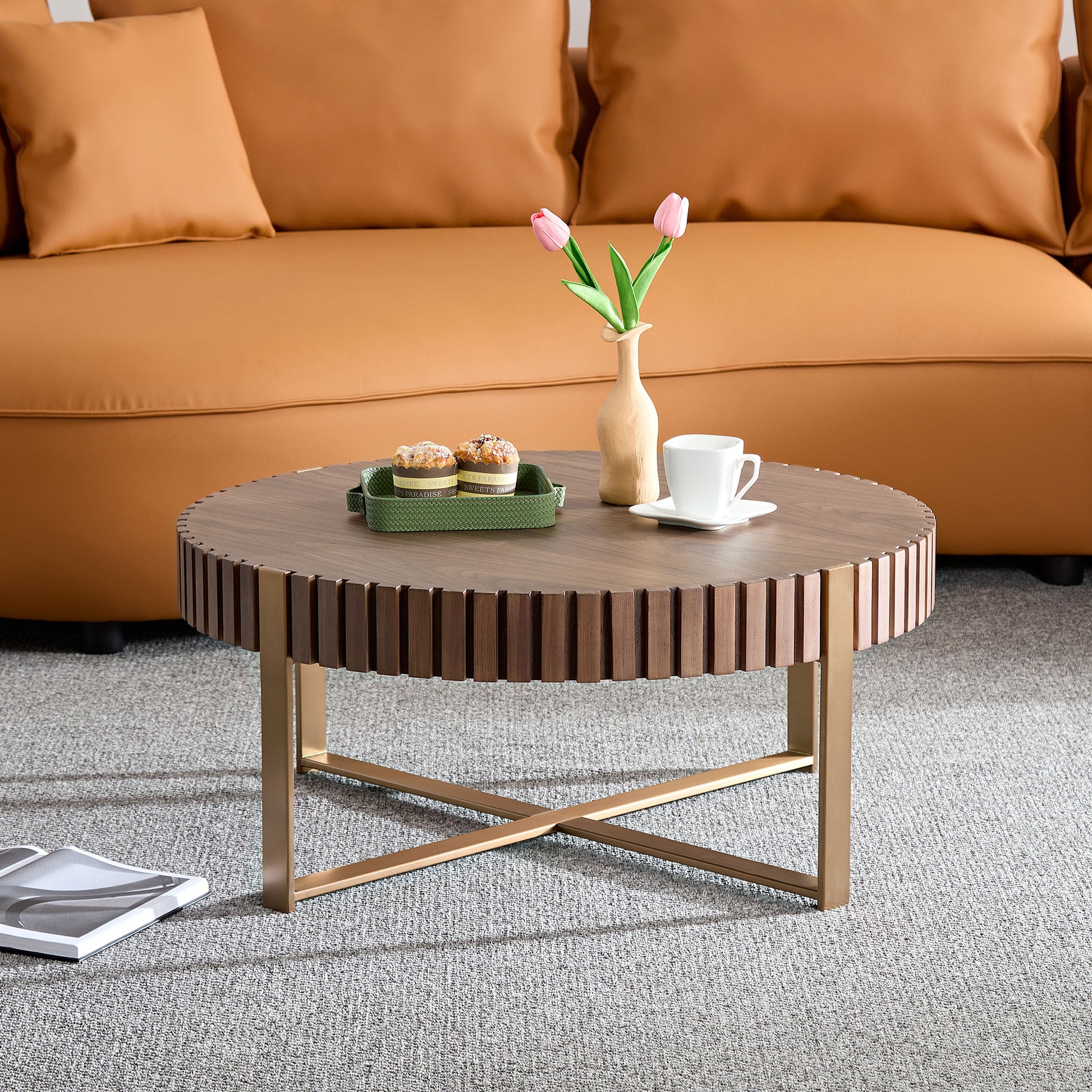 Round walnut coffee table with ribbed side and gold base
