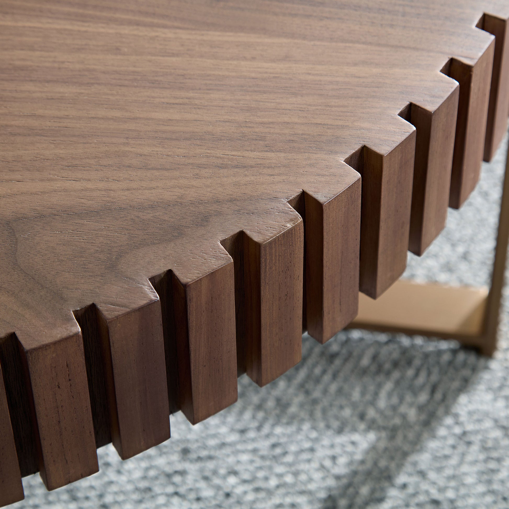 Textured walnut wood coffee table with a unique geometric carved edge design
