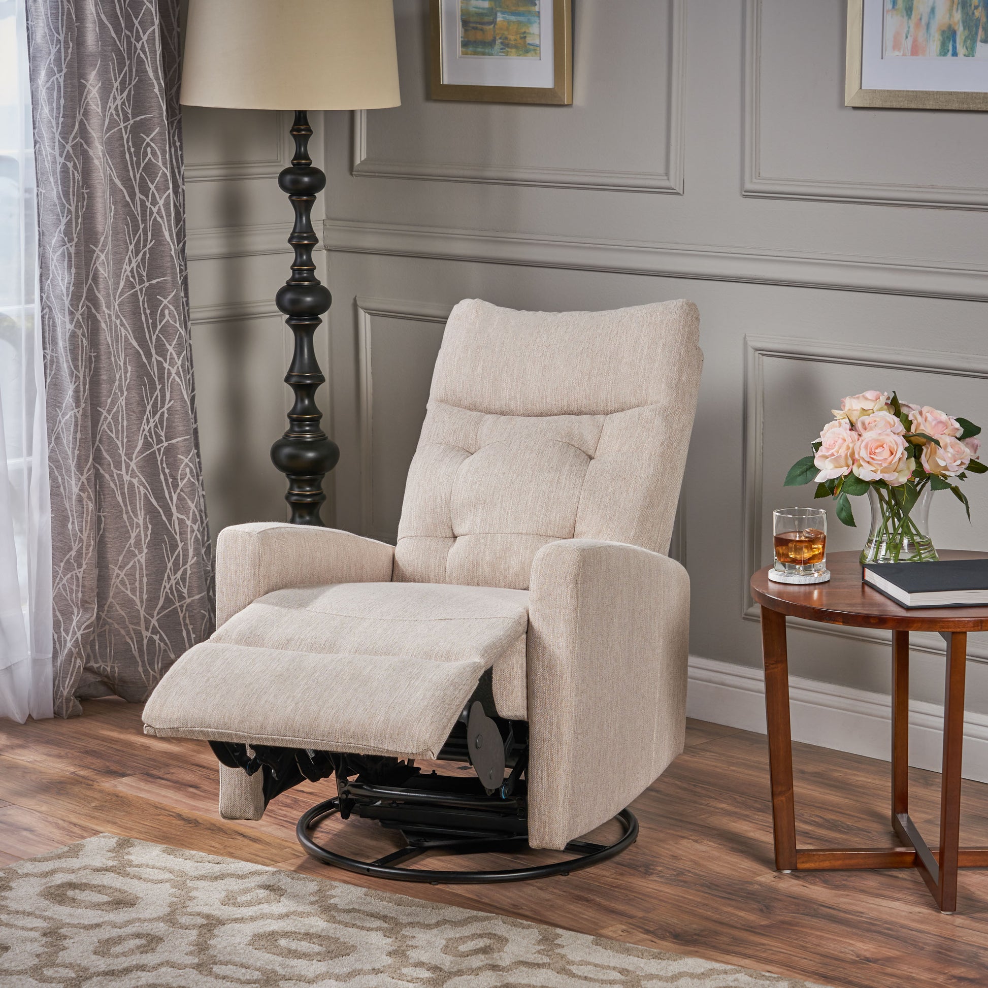 Beige upholstered swivel recliner chair with tufted back and adjustable footrest