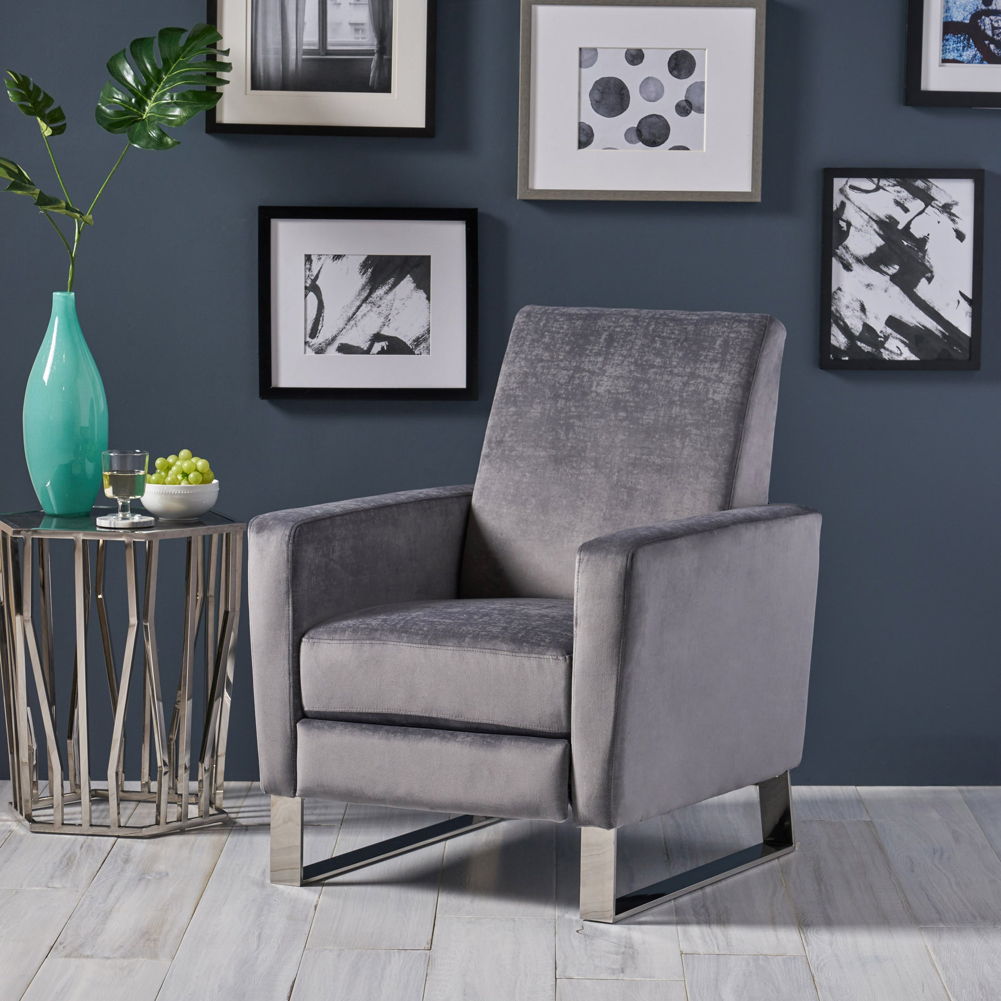 Plush grey velvet armchair with sleek chrome legs perfect for modern living spaces