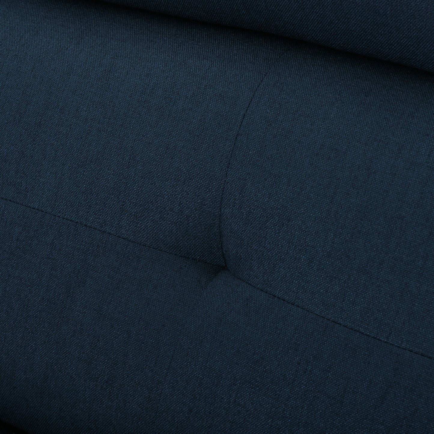 Dark blue textured fabric with subtle diamond stitching pattern