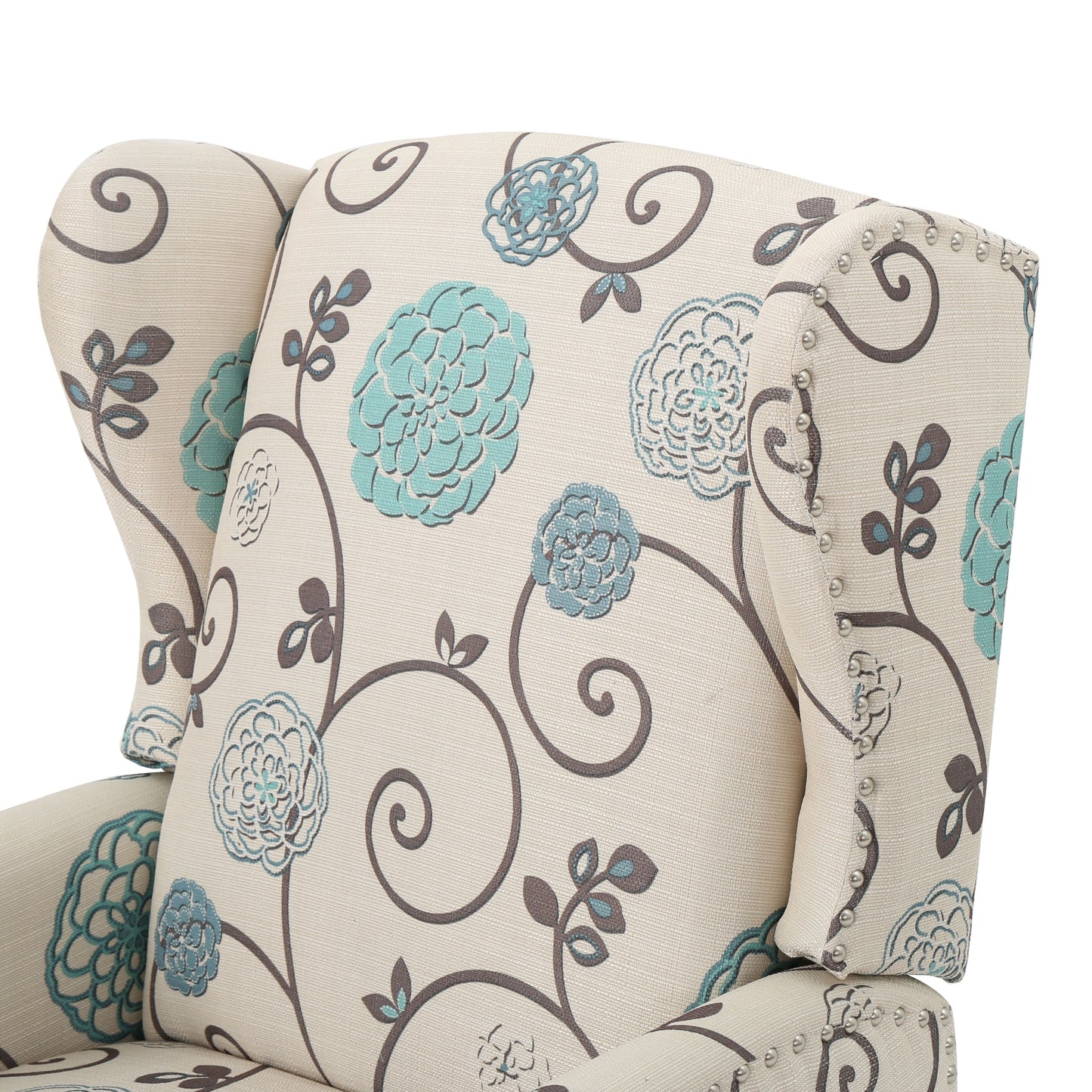 Cream wingback chair with turquoise floral print and nailhead trim accent