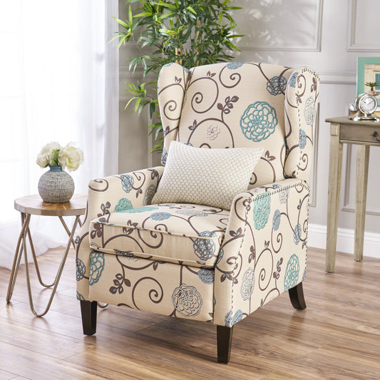 Cream upholstered wingback accent chair with floral scroll pattern and nailhead trim