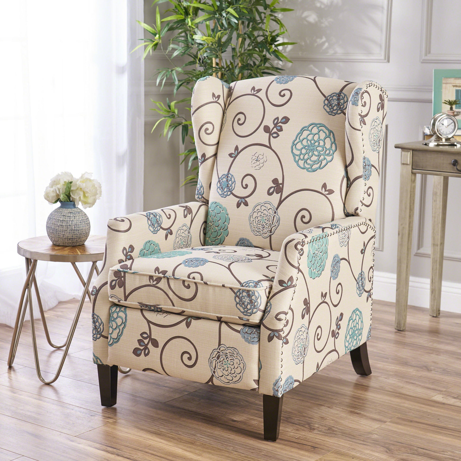 Beige accent chair with scrolling floral pattern in blue and brown