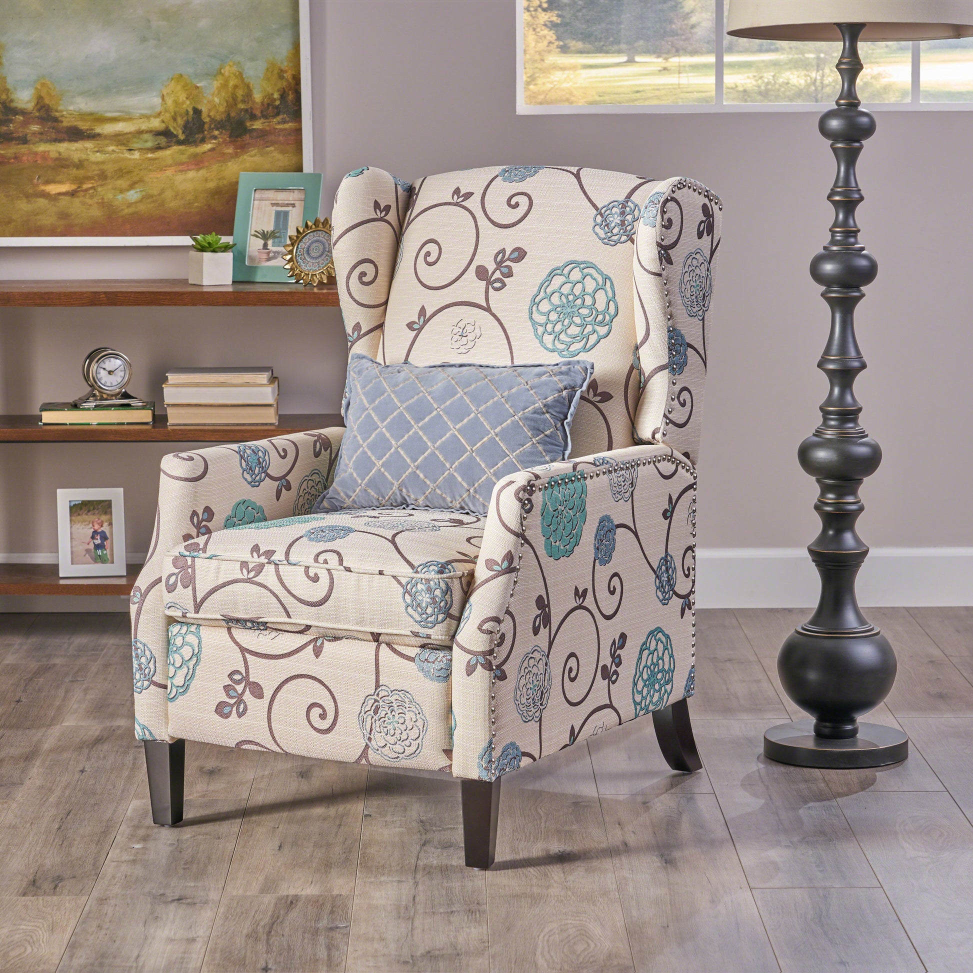 Wingback accent chair with floral pattern upholstery and nailhead trim