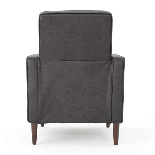 Dark gray faux leather accent chair with tufted back and tapered wooden legs
