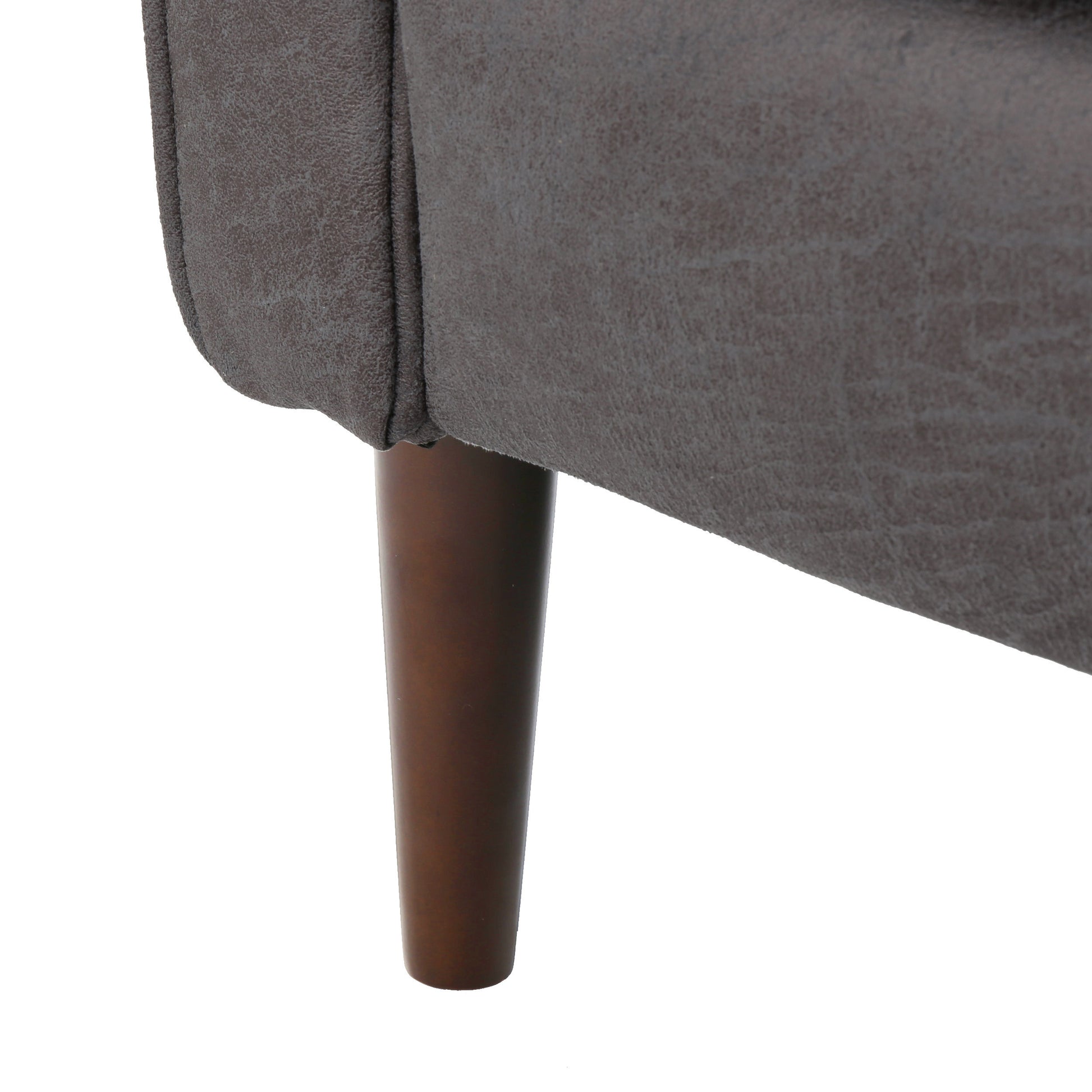 Closeup of textured grey fabric on a modern armchair leg