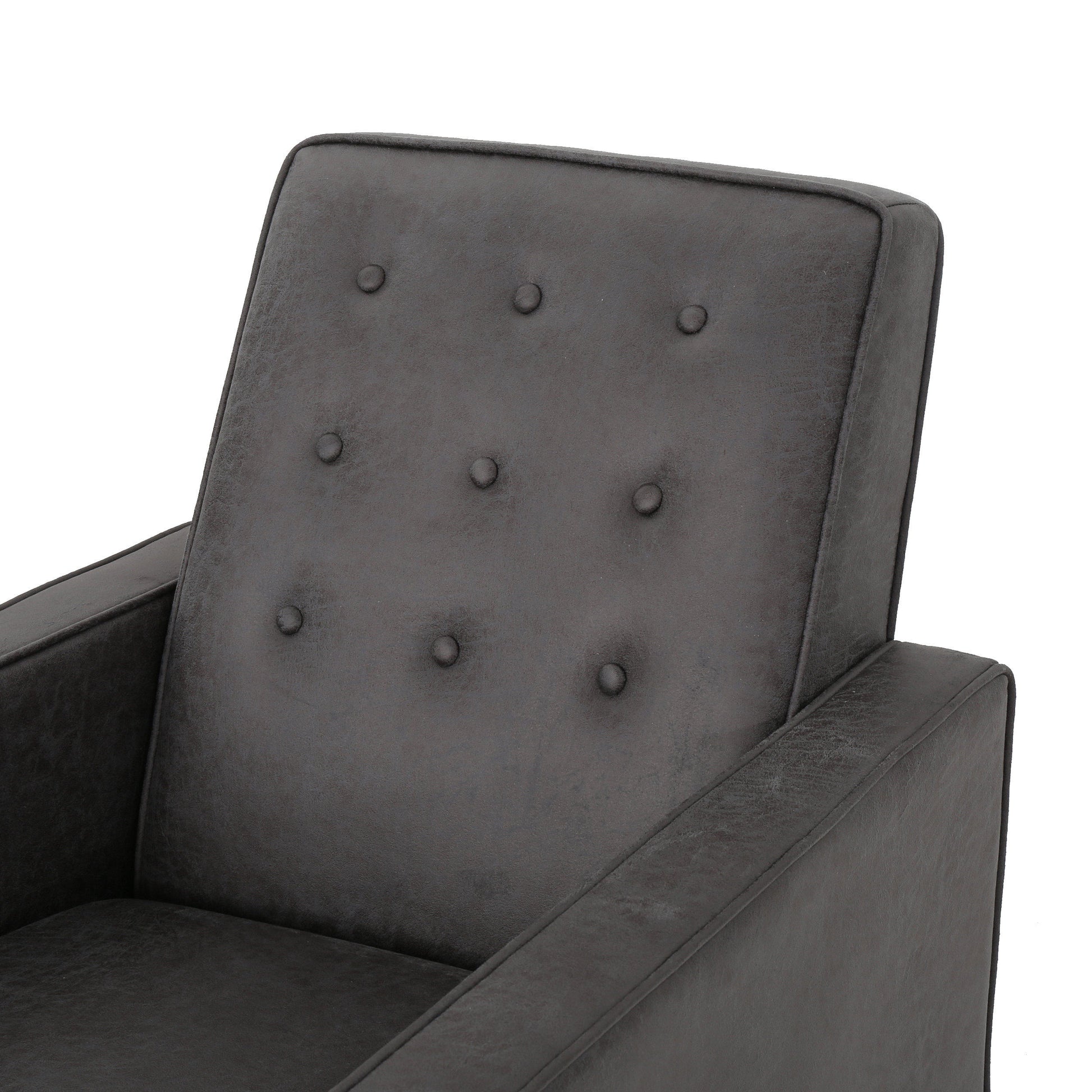 Tufted dark gray faux leather accent chair with deep button details and padded arms