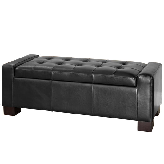 Black tufted storage ottoman with faux leather upholstery and dark wood feet