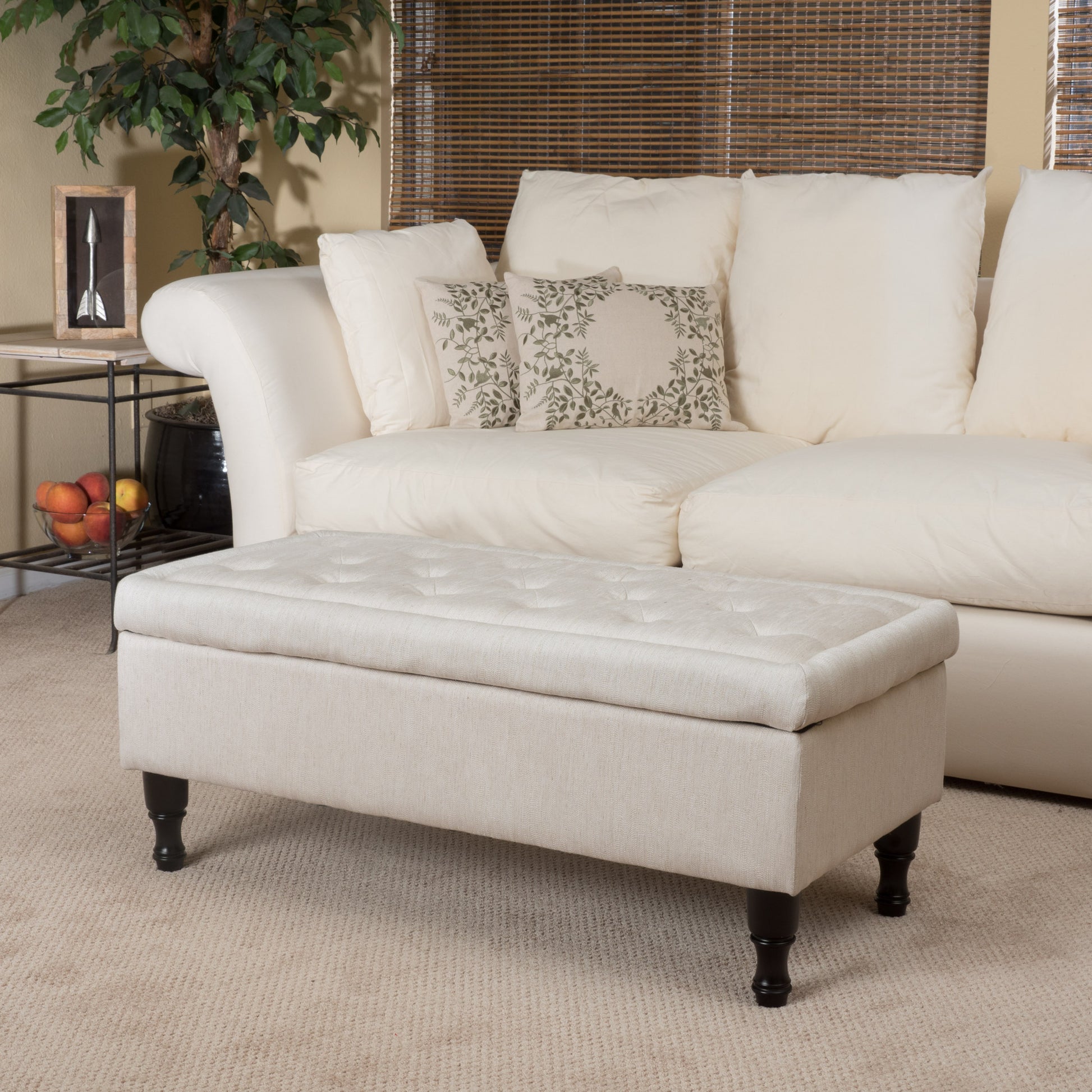 Tufted linen storage ottoman in light beige perfect for living rooms or bedrooms