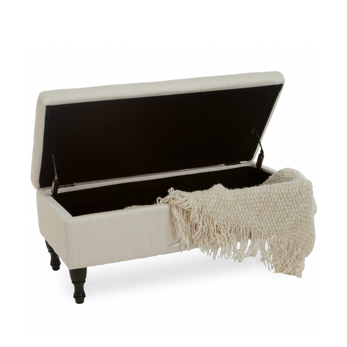 Open beige linen storage bench with dark legs and a textured throw inside