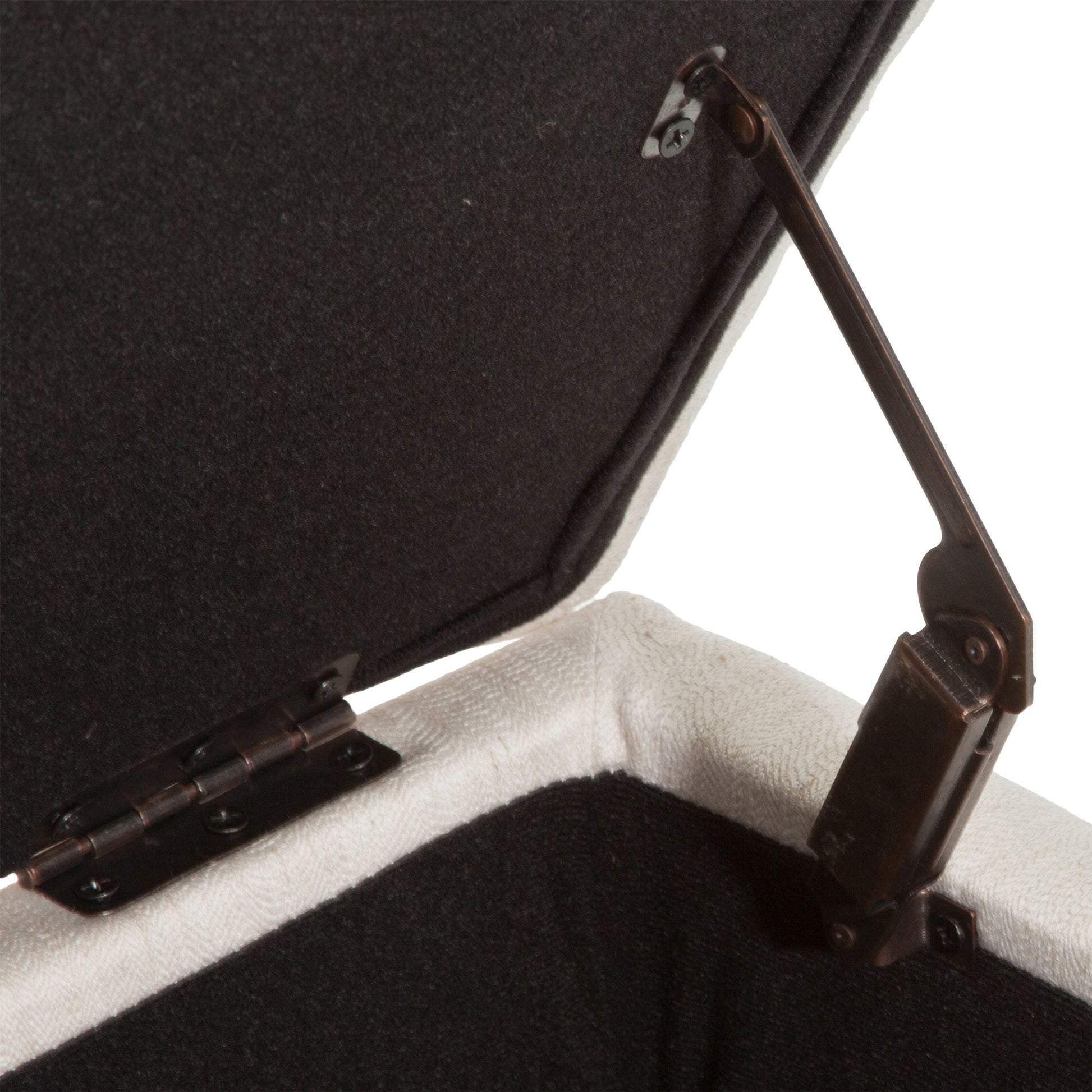 Cream upholstered storage ottoman lid hinge with dark metal mechanism