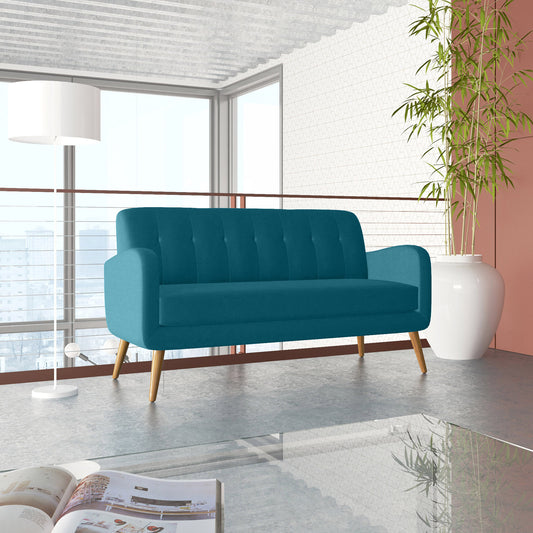 Teal upholstered loveseat with button tufting and tapered wooden legs in a modern living room