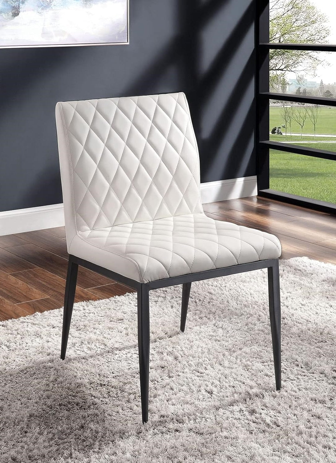 White diamondstitched faux leather dining chair with black metal legs