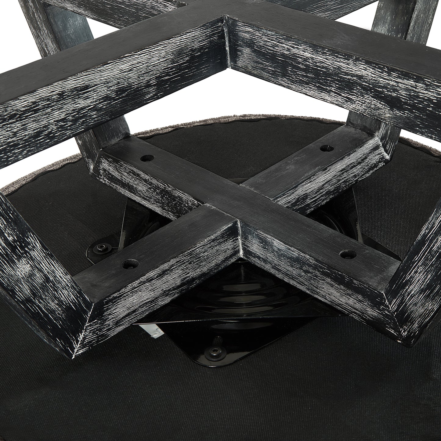Distressed black wooden bar stool base with upholstered seat detail industrial design